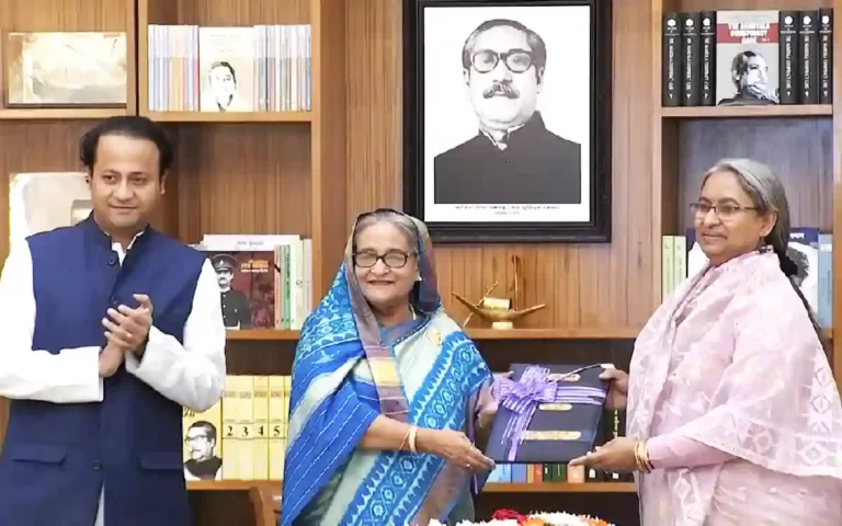 Handing over copy of HSC result to Prime Minister