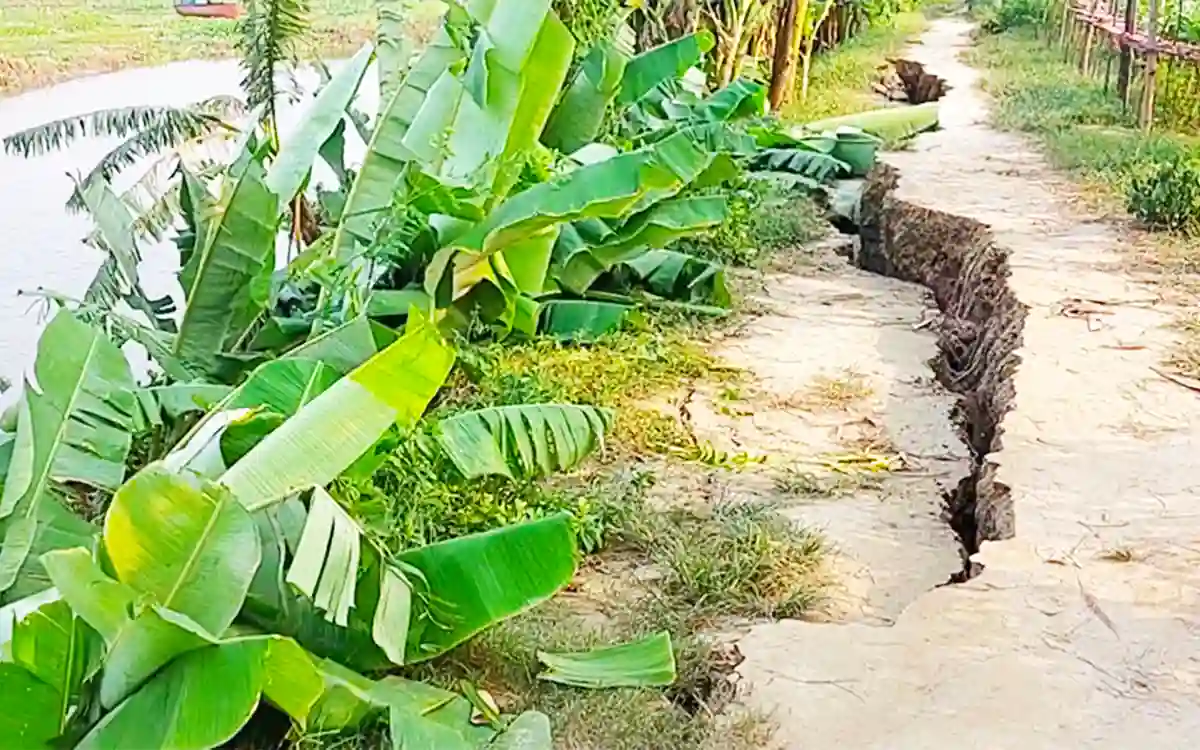 Unplanned river excavation in Titas of Cumilla causes road collapse, houses threatened