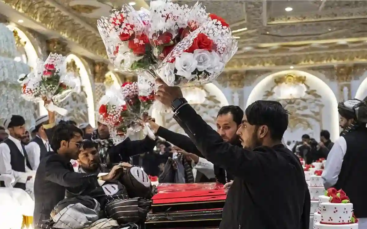 Afghan youths are having mass marriages to save expenses