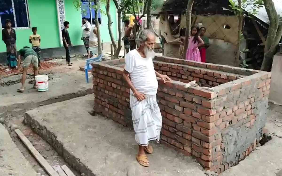 An old man is taking care of his own grave, he wants to make a shrine