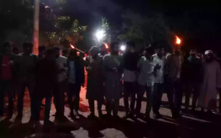 Torch procession in BOB for not withdrawing police complaint against protesting students