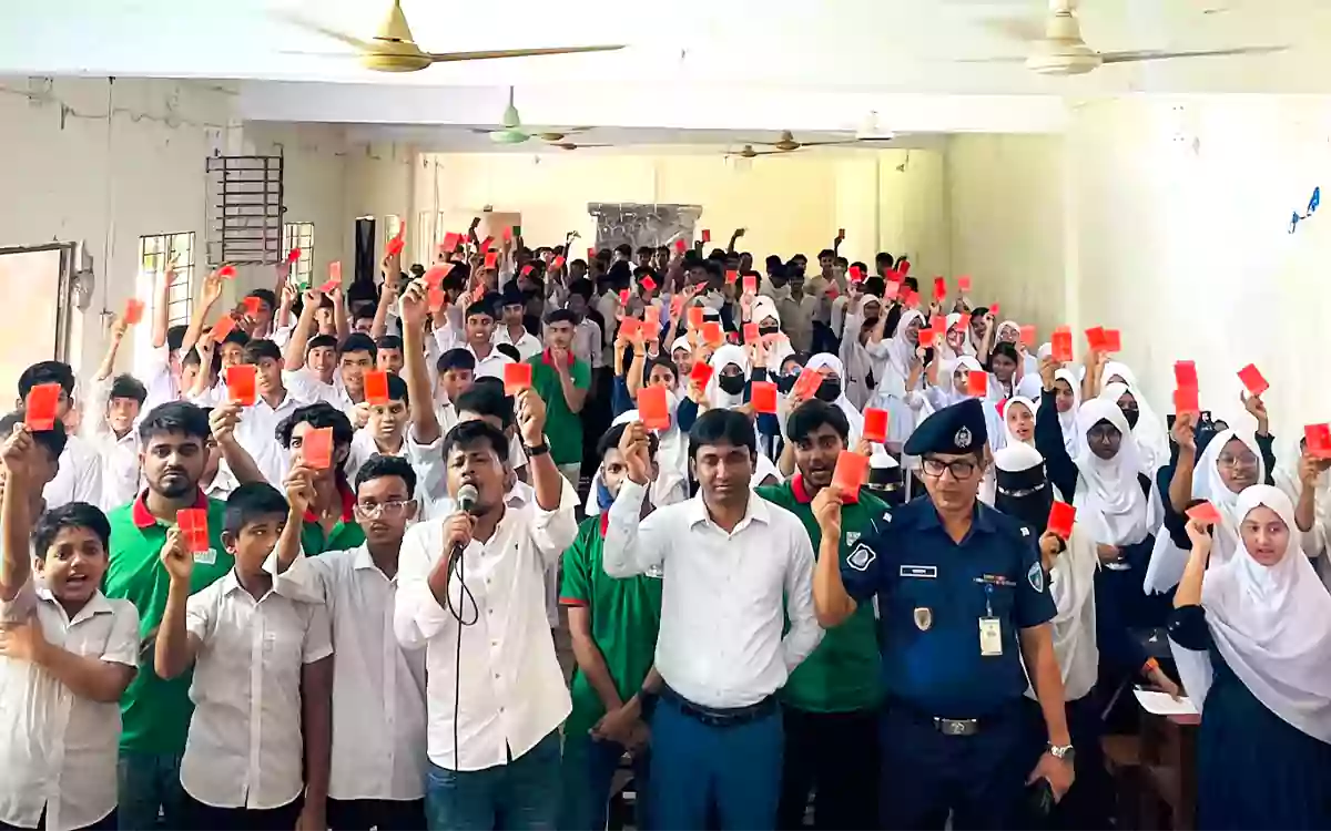 Rising Cumilla - Students in Chandina hold up red cards